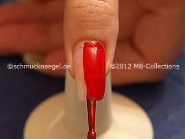 Nail lacquer in the colour red