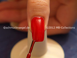 Nail lacquer in the colour red