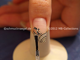 The clear nail lacquer protects the nail art