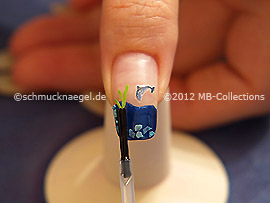 The clear nail lacquer protects the nail art