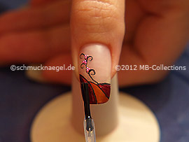 The clear nail lacquer protects the nail art