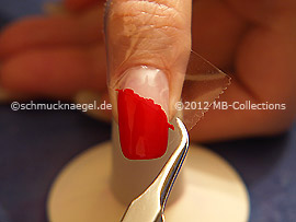 Tweezers and clear adhesive tape