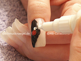 nail art pens in the colours red, white, silver and bronze