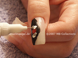 nail art pens in the colours red, white, silver and bronze