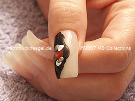 nail art pens in the colours red, white, silver and bronze