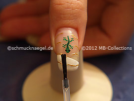 The clear nail lacquer protects the nail art