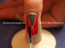 The clear nail lacquer protects the nail art