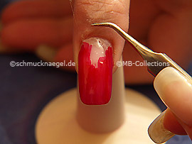 Tweezers and clear adhesive tape