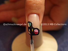 The clear nail lacquer protects the nail art