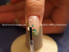 The clear nail lacquer protects the nail art