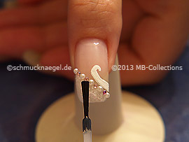 The clear nail lacquer protects the nail art