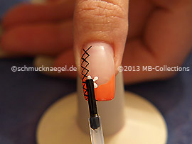 The clear nail lacquer protects the nail art