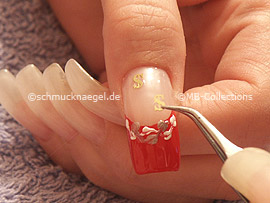 clear nail polish, tweezers and two inlay motifs