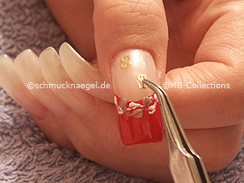 clear nail polish, tweezers and two inlay motifs