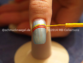 Nail art liner in the colours red, orange, fuchsia, yellow and blue