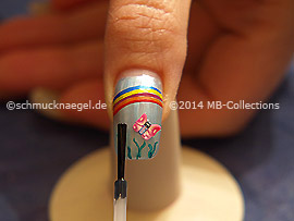 The clear nail lacquer protects the nail art