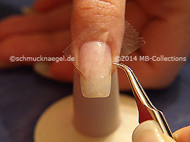 Clear adhesive tape and tweezers