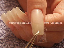 cutter, tweezers and clear adhesive tape