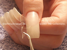cutter, tweezers and clear adhesive tape