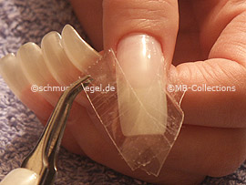 clear adhesive tape, cutter and tweezers