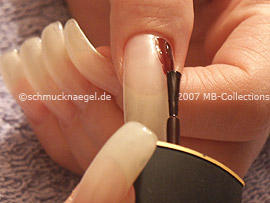nail lacquer in the colour dark-red