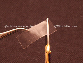 clear adhesive tape, tweezers and cutter