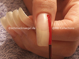 nail lacquer in the colour dark-red