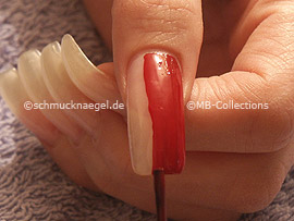 nail lacquer in the colour dark-red