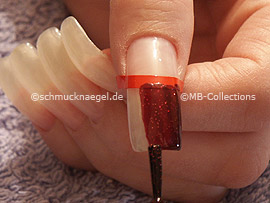 nail lacquer in the colour dark red with glitter