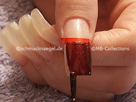 nail lacquer in the colour dark red with glitter