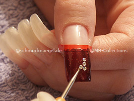 spot-swirl and four strass stones in the colour crystal