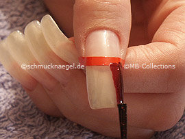 nail lacquer in the colour dark red with glitter