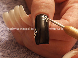clear nail lacquer, the spot-swirl or toothpick and two strass stones