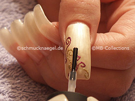 clear nail lacquer, the tweezers and two drop shaped strass stones