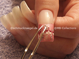 clear nail lacquer, the tweezers and a quadratic strass stone