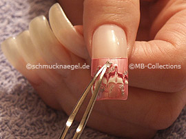 clear nail lacquer, the tweezers and a quadratic strass stone