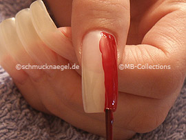 Nail lacquer in the colour dark-red