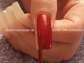 Nail lacquer in the colour dark-red