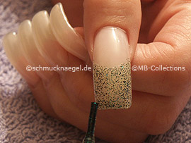 nail lacquer in the colour green-glitter