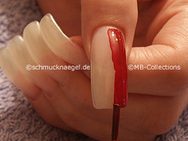 nail lacquer in the colour dark-red