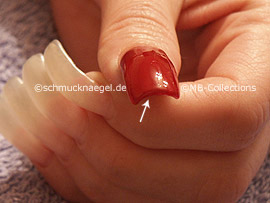 nail lacquer in the colour dark-red