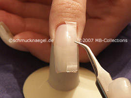 tweezers, cutter and clear adhesive tape