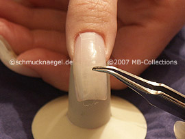 tweezers, cutter and clear adhesive tape