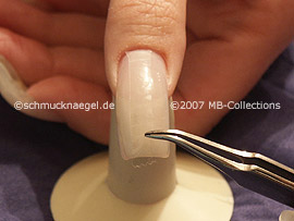 tweezers, cutter and clear adhesive tape
