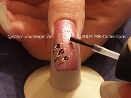 clear nail lacquer, spot-swirl and strass stones