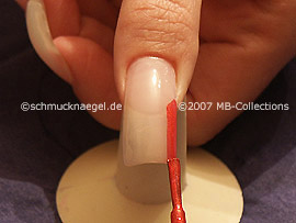 nail lacquer in the colour bright red