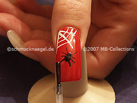 The clear nail lacquer protects the nail art