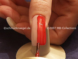 Nail lacquer in the colour red