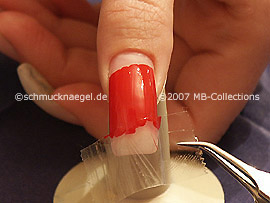 Remove with the tweezers the lower adhesive tape