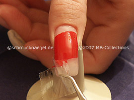 Remove with the tweezers the lower adhesive tape